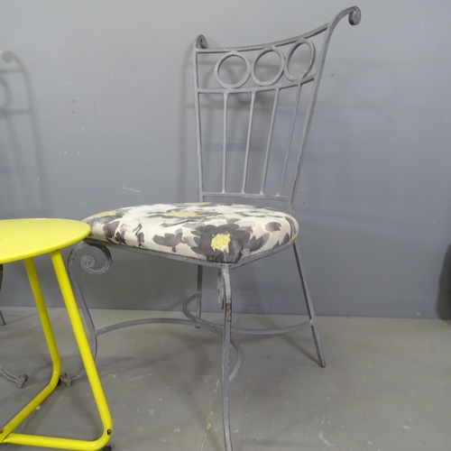 3419 - A pair of painted wrought metal and upholstered garden chairs, with a painted low table on tubular m... 