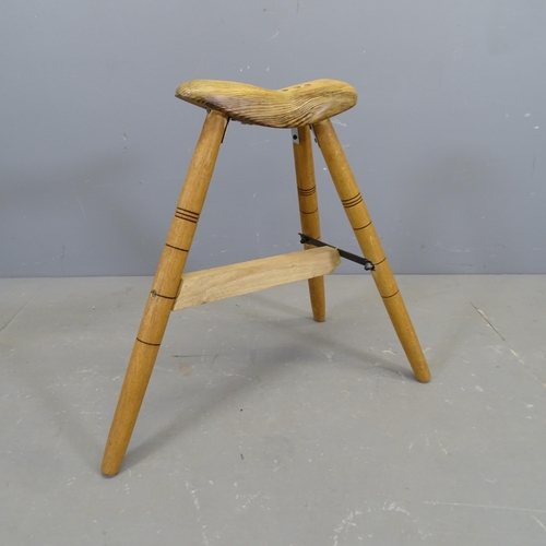 3420 - A handmade bicycle seat design stool on tripod base, by local artist Clive Fredriksson. Height 59cm.