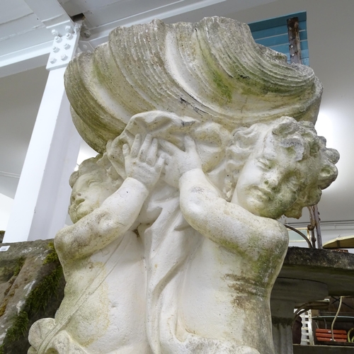 3421 - A weathered stone garden water feature, in the form of two cherubs supporting a shell. 62x100x53cm.