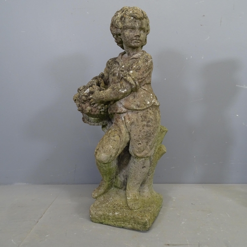 3423 - A weathered concrete garden statue, study of a woman with basket. Height 73cm.