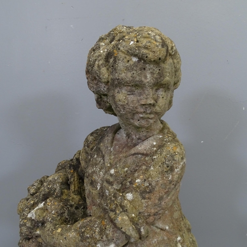 3423 - A weathered concrete garden statue, study of a woman with basket. Height 73cm.