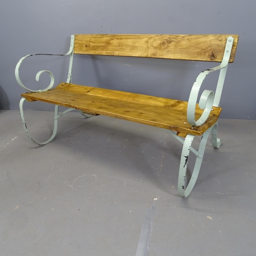 3426 - A stained pine garden bench with painted antique wrought iron ends. 122x74x62cm.