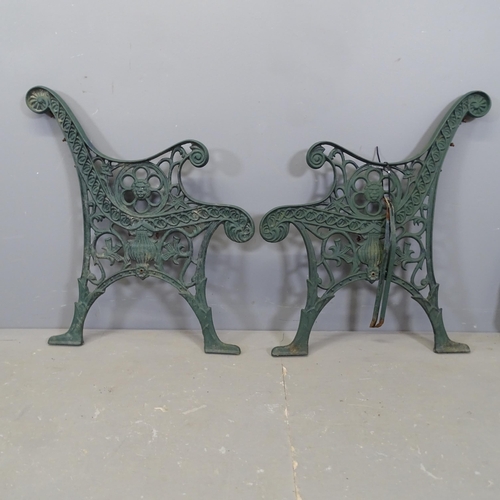 3427 - A pair of painted cast iron garden bench ends. 65x76cm.