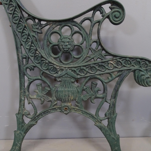 3427 - A pair of painted cast iron garden bench ends. 65x76cm.