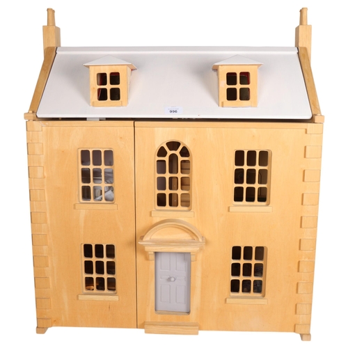 942 - A modern wooden doll's house with 3 floors, containing various furniture and Sylvanian Families figu... 