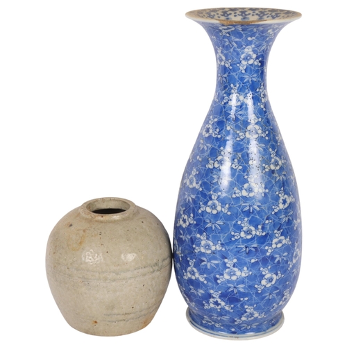 930 - A Chinese blue and white vase with prunus decoration, 10 character mark to the base, H33cm (rim chip... 