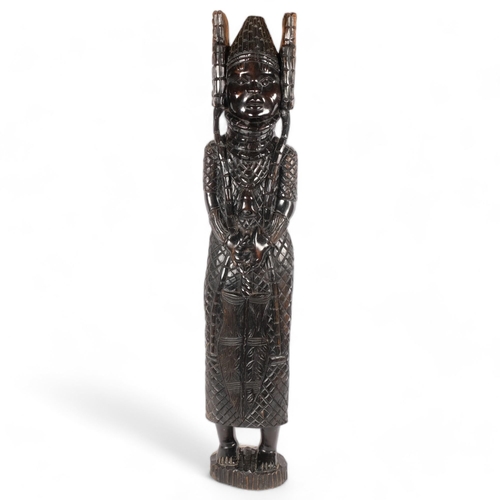 117 - PNG - A large carved hardwood study of a Tribal figure, H91cm