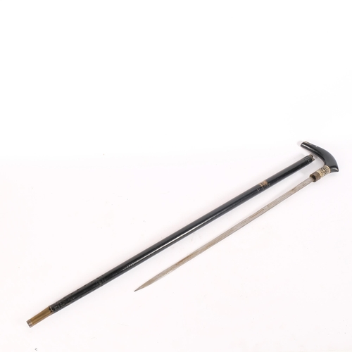 13 - An Anglo-Indian ebonised swordstick, with carved animal head handle, L89cm, blade length 54cm