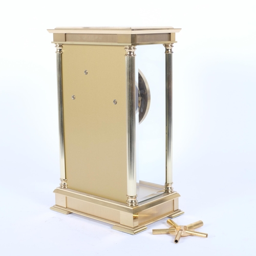 27 - Hermle, Germany, a brass-cased 3-glass panel 8-day striking mantel clock, with key and pendulum, H28... 