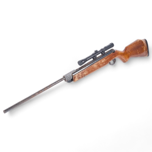 64 - A Webley Vulcan 1.77 air rifle with associated scope, L104cm