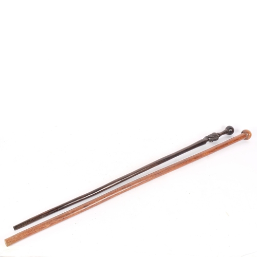 65 - A Zulu lignum vitae ball end stick, length 93cm, and an African hardwood stick with carved head (2)