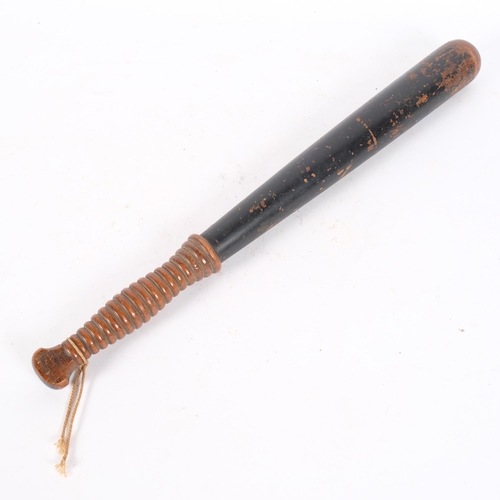 68 - A Victorian ebonised and turned wood truncheon, with ribbed handle, partial paint remains, with gild... 