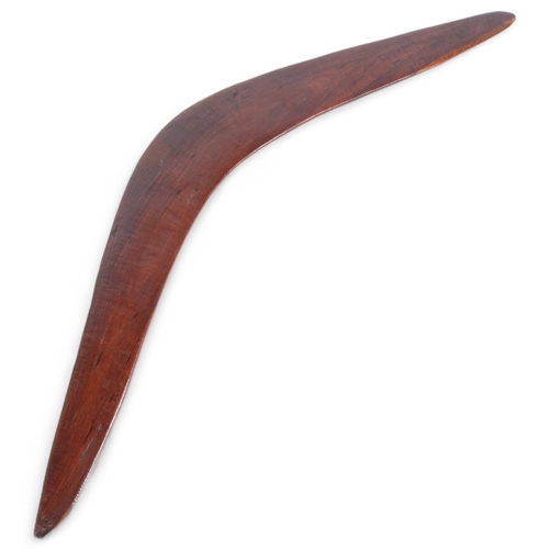 69 - An Aboriginal boomerang, tip to tip 69cm