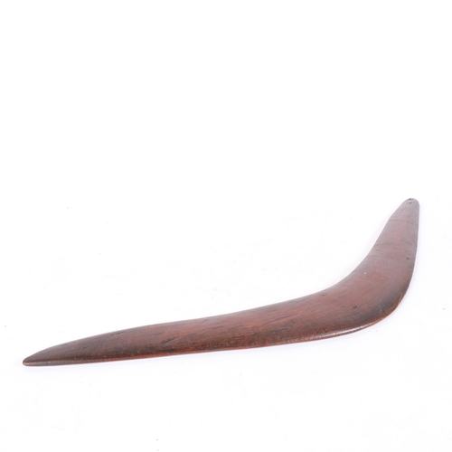 69 - An Aboriginal boomerang, tip to tip 69cm