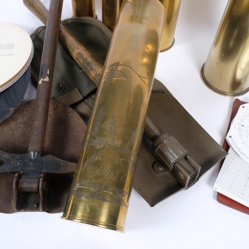 89 - 3 First World War brass shell cases, 2 Second World War brass shell cases, 2 trench spades, a hydrog... 