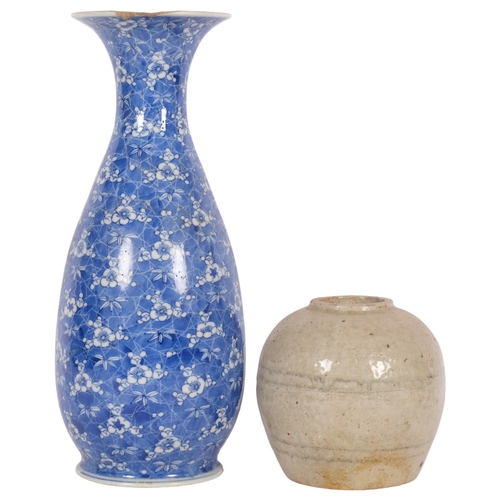 930 - A Chinese blue and white vase with prunus decoration, 10 character mark to the base, H33cm (rim chip... 