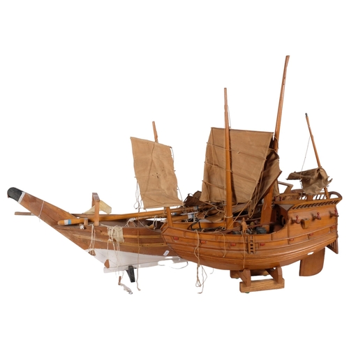 935 - A wooden model galleon with sails and rigging, L57cm, and a hand-built wooden model sailing ship, L1... 