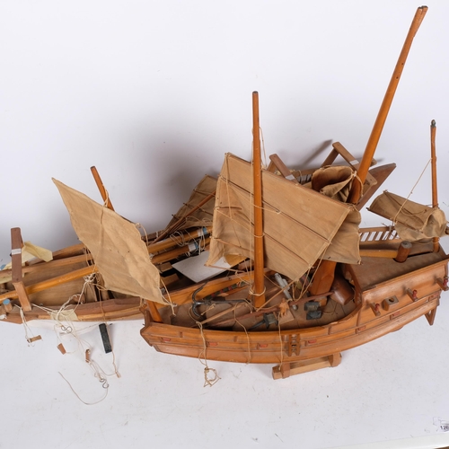 935 - A wooden model galleon with sails and rigging, L57cm, and a hand-built wooden model sailing ship, L1... 