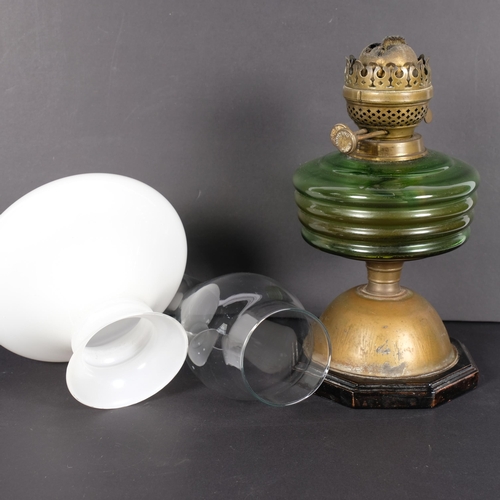 937 - A Vintage oil lamp, with green glass, funnel and shade included but are unassociated to oil lamp