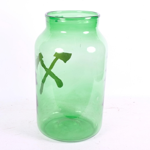 962 - A large green glass vase, with gilded cross axe decoration, H43cm