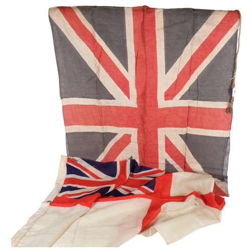 965 - A Royal Navy white ensign, 67cm x 135cm, and a 20th century Union Jack, 82cm x 112cm approx (2)