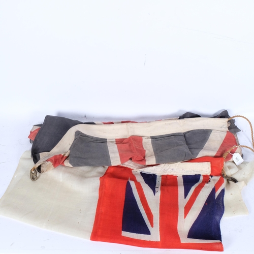 965 - A Royal Navy white ensign, 67cm x 135cm, and a 20th century Union Jack, 82cm x 112cm approx (2)