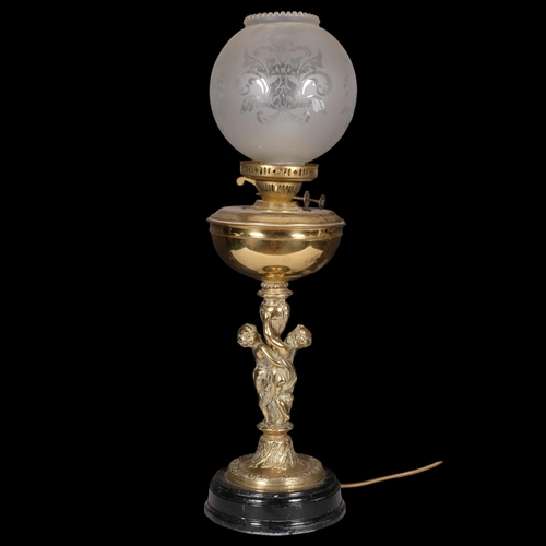 986 - Gilt-metal oil lamp converted to electric, with cherub support, H69cm