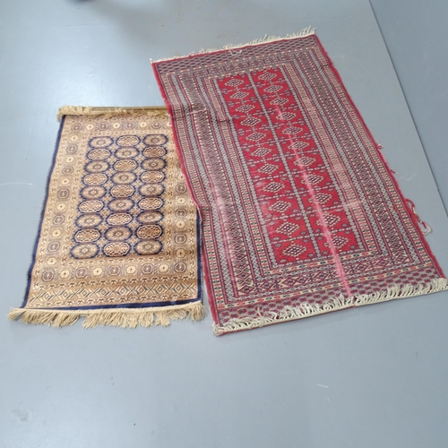 2301 - A cream ground Persian rug and an Afghan rug, a red ground Afghan rug and a part-silk Afghan mat. La... 