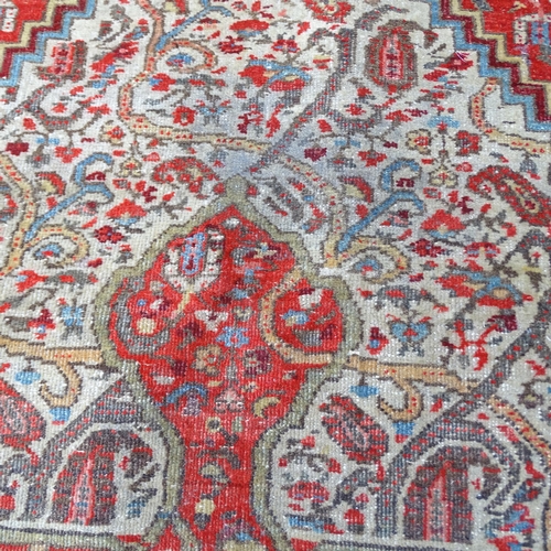 2325 - A red ground Isfahan carpet, 195x130cm.