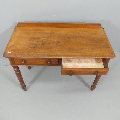 2277 - A Victorian mahogany writing table, with raised back, two frieze drawers and raised on turned legs. ... 