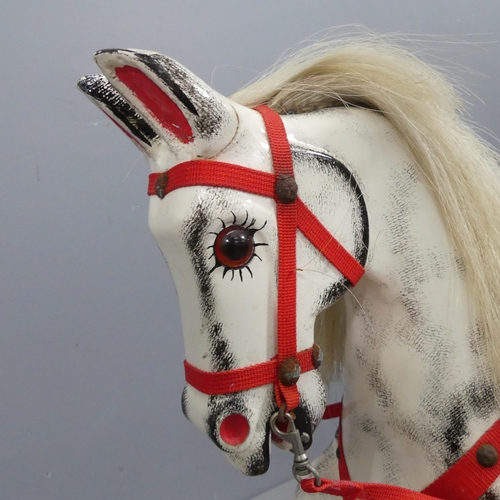 2281 - A painted wooden rocking horse. 147x70x33cm.