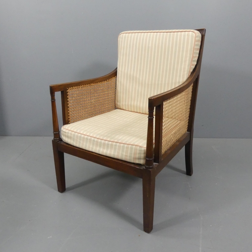 2282 - A Regency style Bergere chair with caned back and sides.