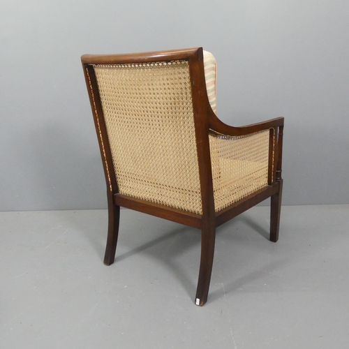 2282 - A Regency style Bergere chair with caned back and sides.