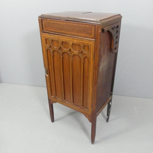 2285 - A mahogany Arts & Crafts style cabinet, with fold-over top, single door and applied carved and inlai... 