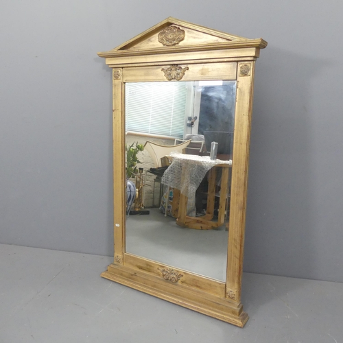 2295 - A French empire stile gilt-painted wall mirror with applied carved decoration. 81x128cm.