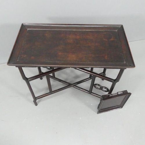 2299 - A Chinese mahogany rectangular tray top table on folding base, 74x66x39cm.