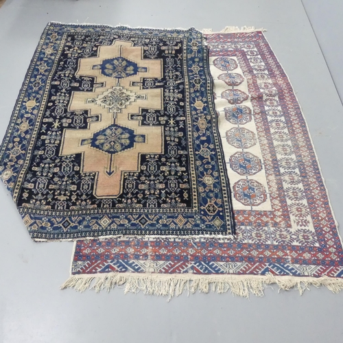 2300 - A blue ground Persian rug, 180x120cm, and a cream ground Afghan rug, 190x120cm. A/F.