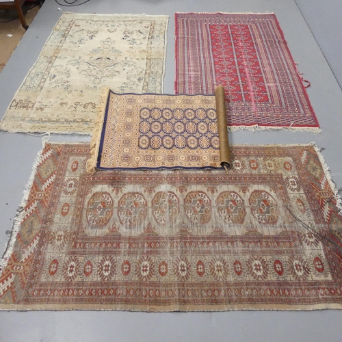 2301 - A cream ground Persian rug and an Afghan rug, a red ground Afghan rug and a part-silk Afghan mat. La... 