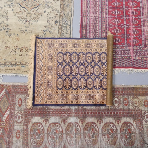 2301 - A cream ground Persian rug and an Afghan rug, a red ground Afghan rug and a part-silk Afghan mat. La... 