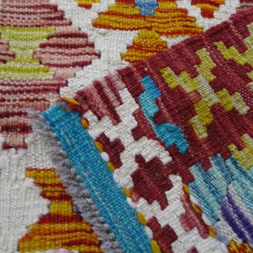 2302 - A red and teal ground chobi kilim runner, 245x84cm.