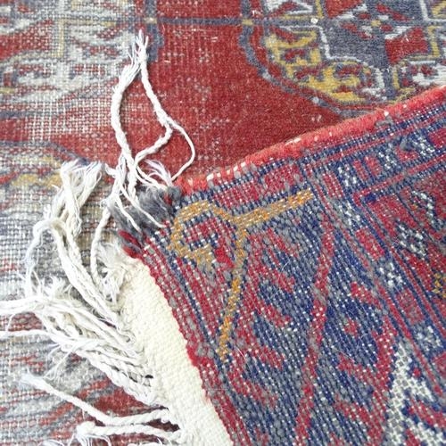 2324 - A red ground Afghan rug, 154x96cm.