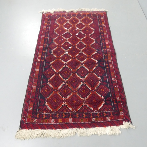 2334 - A red-ground Turkish rug. 169x96cm.