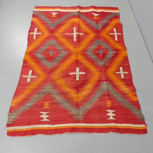 2336 - A red-ground Kilim rug. 190x130cm.