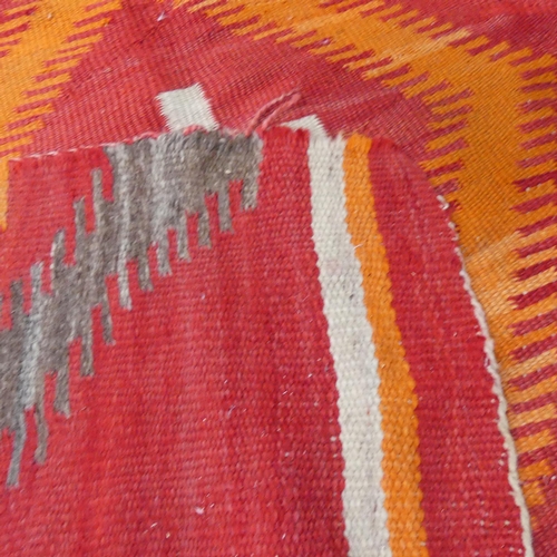 2336 - A red-ground Kilim rug. 190x130cm.