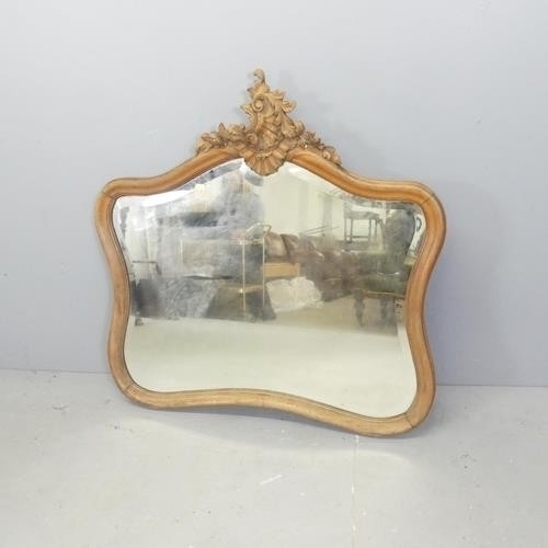 2280 - A French walnut framed wall mirror, with carved decoration. 100x100cm.