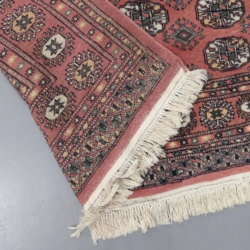 2338 - A red-ground Afghan rug. 182x125cm.