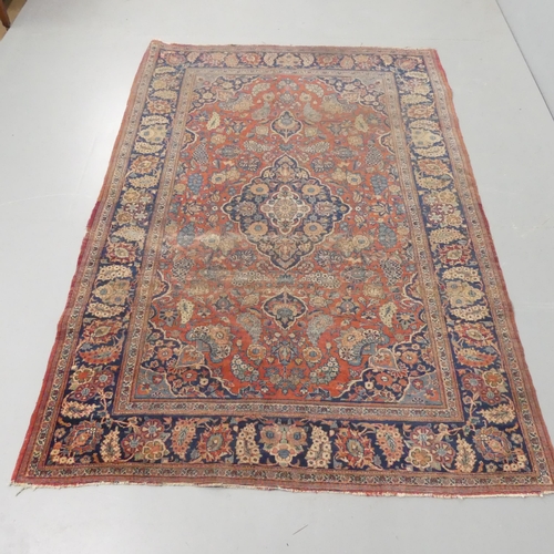 2340 - An antique red-ground Persian rug. 200x135cm.