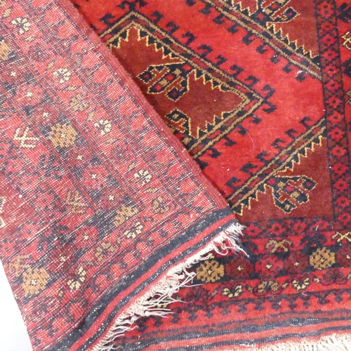 2341 - A red-ground Baluchi rug. 143x105cm.