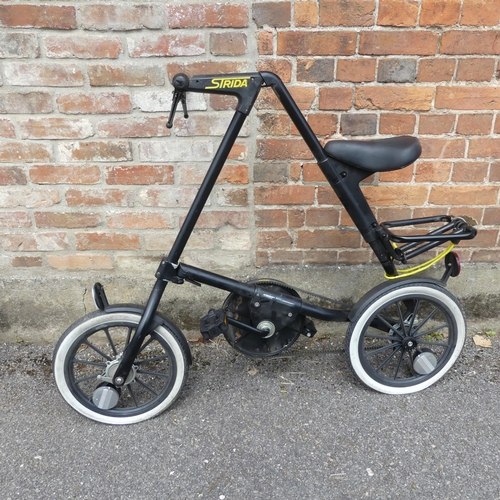 2359 - A Strida black folding bicycle.