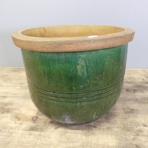 3432 - A glazed terracotta garden pot. 38x30cm.